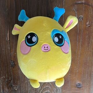 Cute Yellow “Squeezamal” Plush Toy with Blue accents